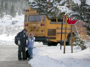 Andrew and neighbor at school bus - February 3, 2004