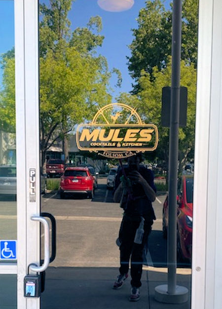 Mules Cocktales & Kitchen stencil sign applied to door